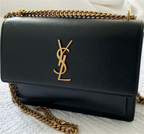 does all ysl bags have engraving on the button|authentic YSL Bag.